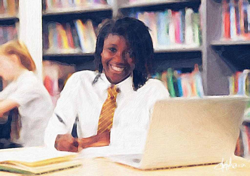 A young student with a laptop