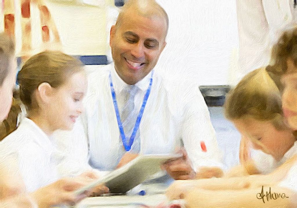 A primary school teacher helping pupils